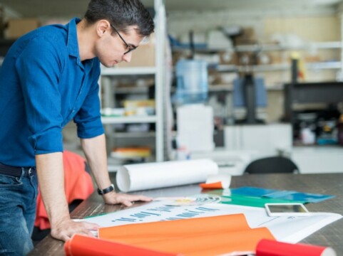 Man working on banner printing design