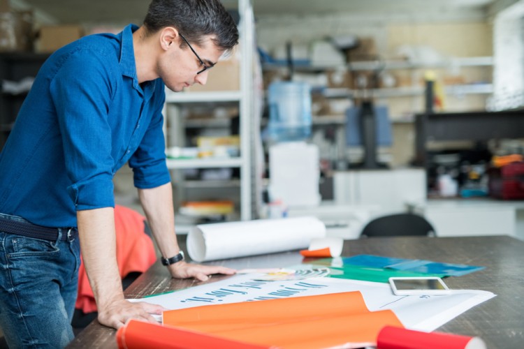 Man working on banner printing design